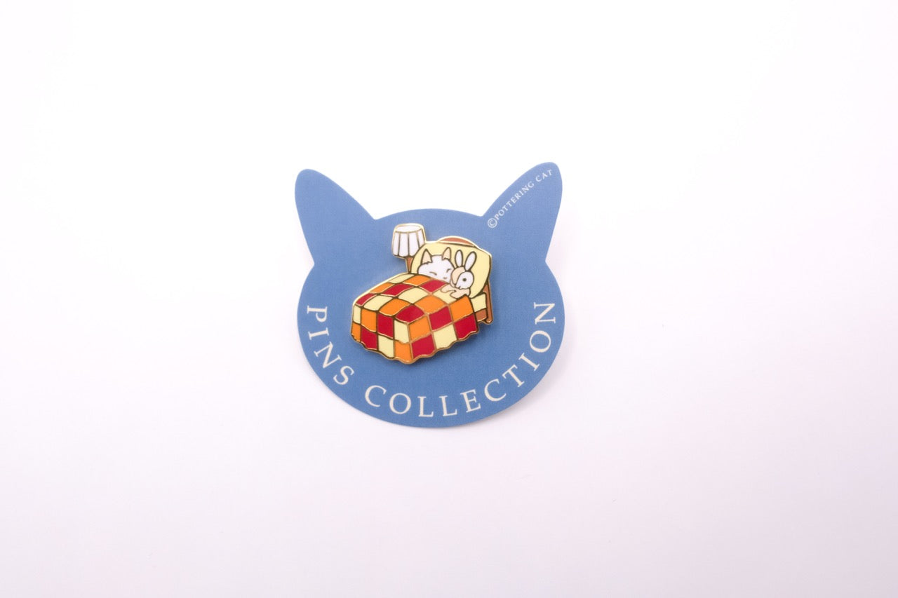 Pottering Cat - Enamel Pin - Bed