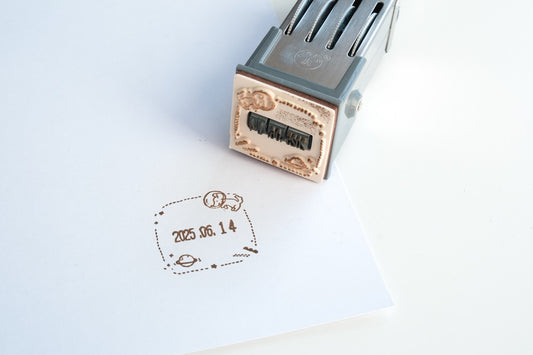 Ginny Lambkin - Rotating Date Stamp - Space Travel