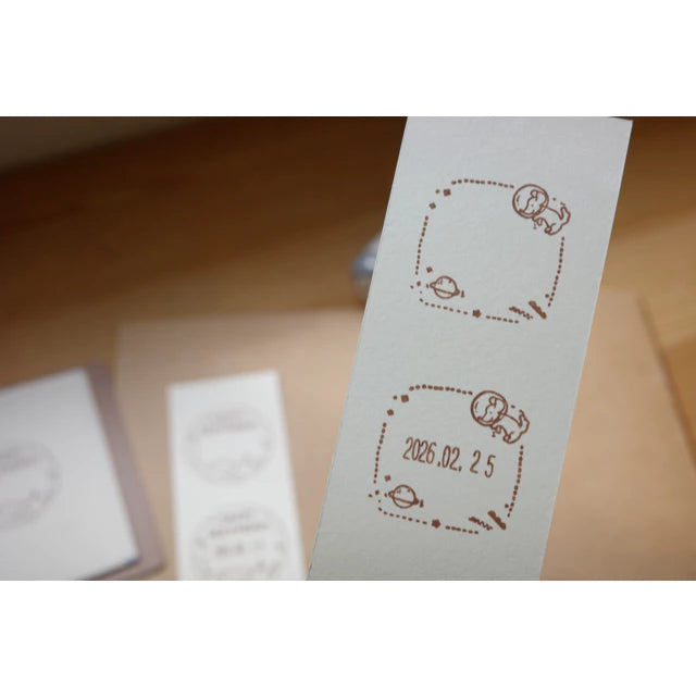 Ginny Lambkin - Rotating Date Stamp - Space Travel